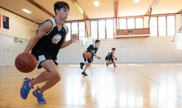 Basketball camper practicing driving