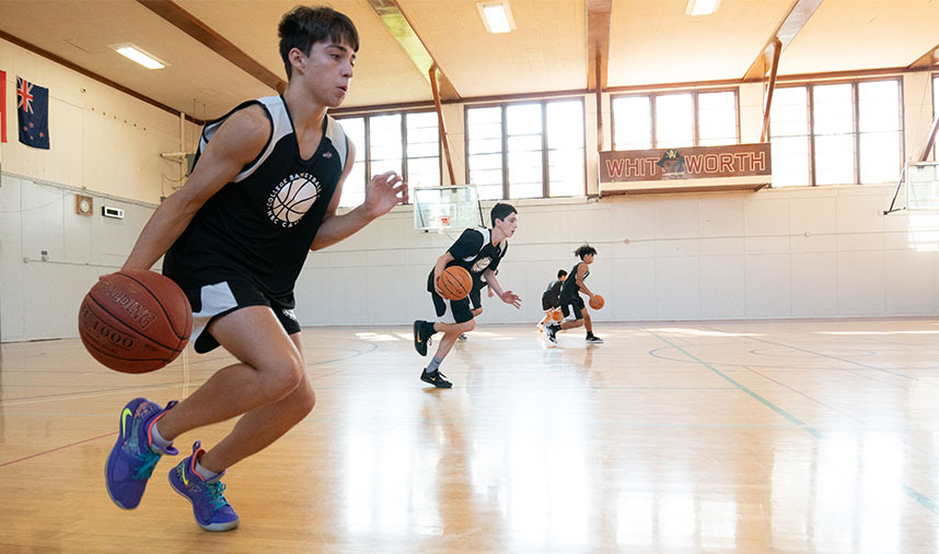 Basketball camper practicing driving